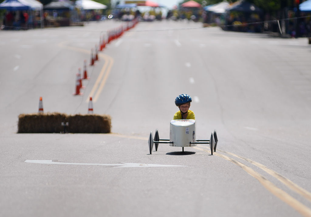 Clayton Sibit grins in his car after winning his soap box car race